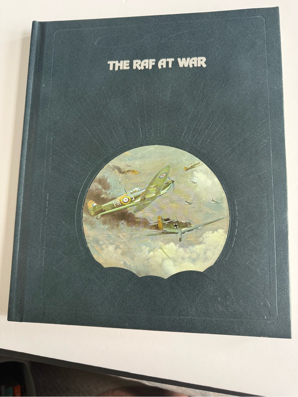 The RAF at War Hardcover Book — Dark Teal Cover with Aircraft Illustration